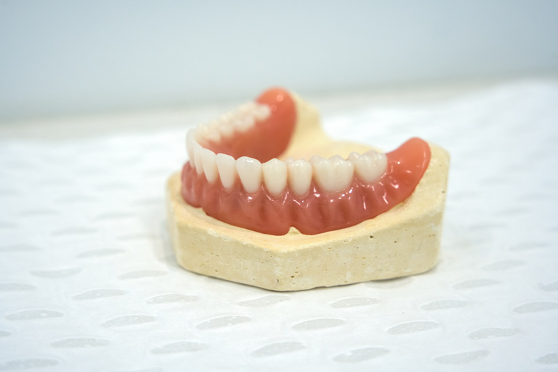meticulously cleaned and well-maintained dentures, highlighting the importance of proper denture health care